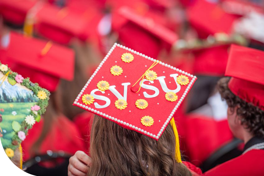 student cap says SVSU during commencement